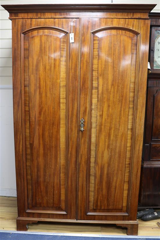 A mahogany two-door wardrobe, W.113cm